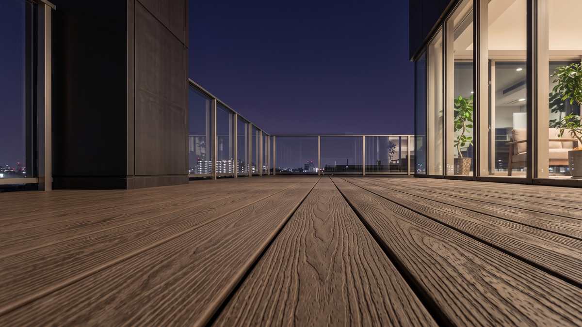 Outdoor wpc decking installed on a modern city balcony at night
