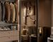 luxury mirrored closet door with a slim black frame and wood closet in bedroom