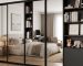 modern mirrored closet door with a slim black frame in a minimalist bedroom