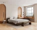 Light natural oak hardwood flooring in a modern minimalist bedroom with warm sunlight.