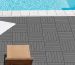 Barefoot person walking safely on a splinter-free grey WPC composite deck tile surround next to an outdoor swimming pool