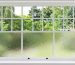 White double-hung residential window featuring clear glass on the top sash and frosted obscured glass on the bottom for privacy.